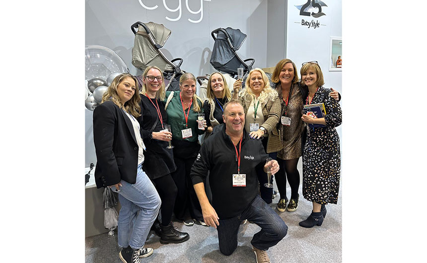 Babystyle's md Andy Crane celebrating the company's 25th with (l-r) Natasha Hewett (Project Baby Magazine), Samantha Loveday (PreschoolNews.net), Adeline St John and Kerry Haynes (both Media Snug), Sally Hall, Jo Cassidy and Tessa Clayton (both PreschoolNews.net).